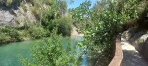 Pou de la Reixa is the biggest pool at Pou Clar Ontinyent with a walkway on one side and the mountain at the other