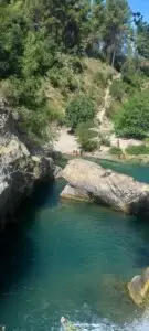 This big rock allows cliff jumpers to leap into the paradise that is Pou Fosc