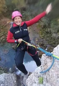 Abseiling down a waterfall in Anna (Wet Canyoning)