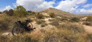 Road bike on the hill near the big ruin