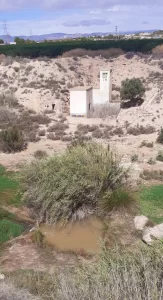 Building and pool in the river bed