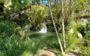 Pool with waterfall on the Sella Ruta del Agua